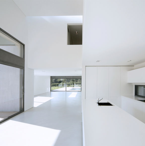 This image shows a kitchen with a white epoxy floor.