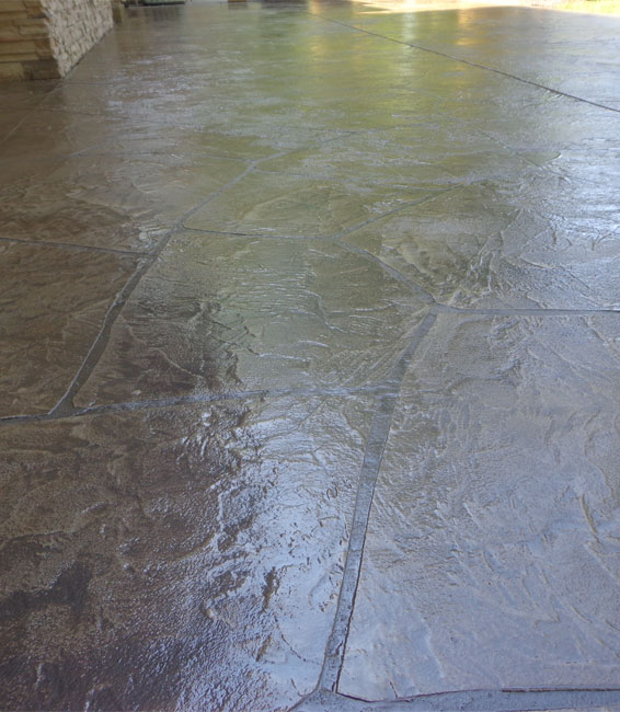 This image shows a patio with stamped concrete overlay floor.
