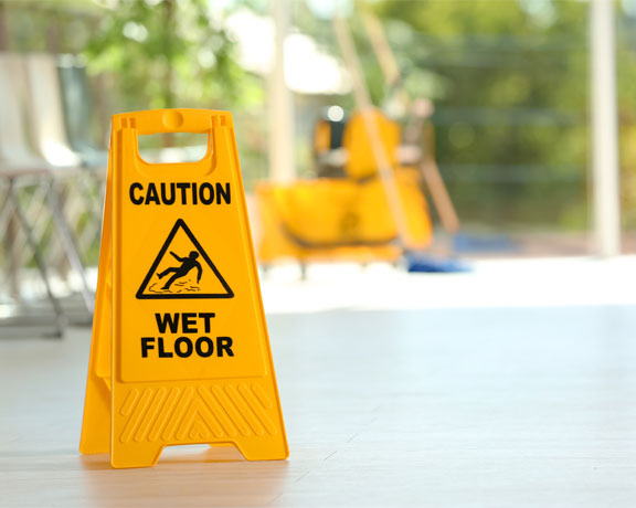 This image shows a caution sign for wet floors.