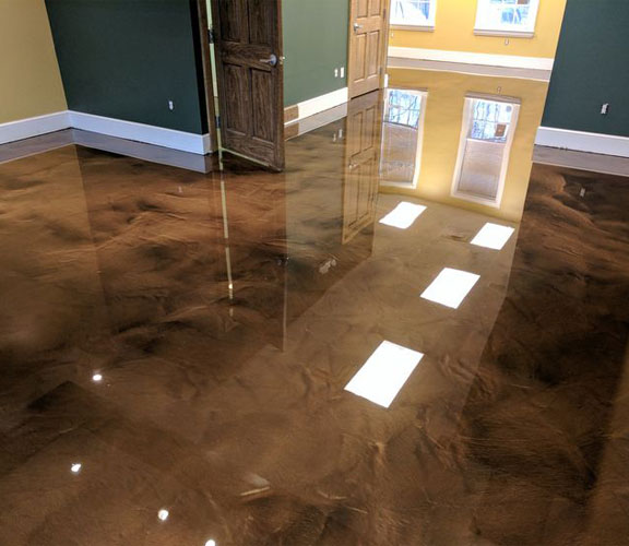 The image shows a living area with nice epoxy flooring floor. There are many options to choose from for epoxy floors.