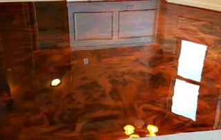 This image shows a living room with a metallic epoxy floor.