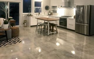 This image shows a kitchen with a gray epoxy floor.