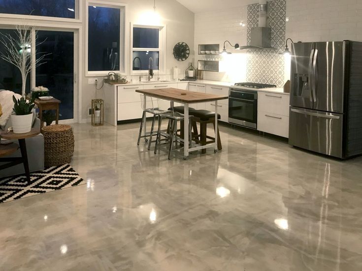 This image shows a kitchen with a gray epoxy floor.