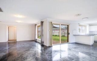 The image shows a living area with a nice epoxy flooring floor.